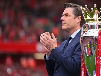 Richard Masters with 2024-25 Premier League trophy