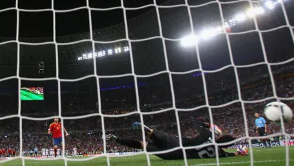 Spain&#39;s Cesc Fabregas scores in the Donbass Arena