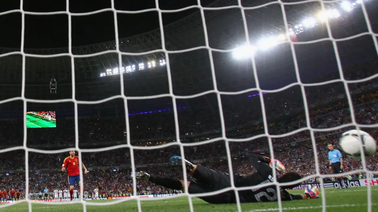 Spain&#39;s Cesc Fabregas scores in the Donbass Arena
