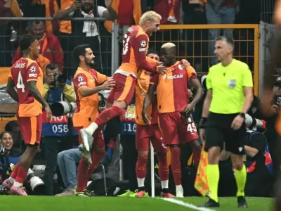 Victor Osimhen celebrates with teammates after scoring for Galatasaray in their win against Liverpool (Ozan KOSE)
